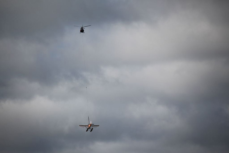 Forest Helicopter Carrying Float Plane