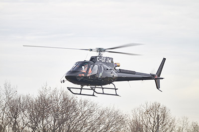 Forest Helicopters In Flight Above Trees